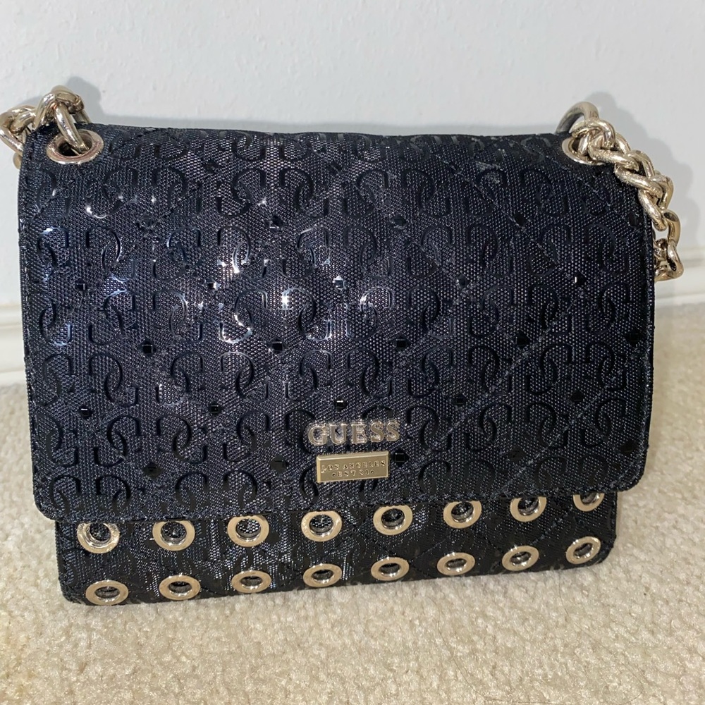 Guess Black flap crossbody purse
Black and gold